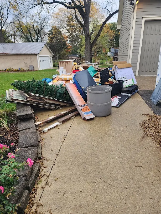 Dumpster being loaded with debris for Commercial Dumpster Rental in Stratmoor